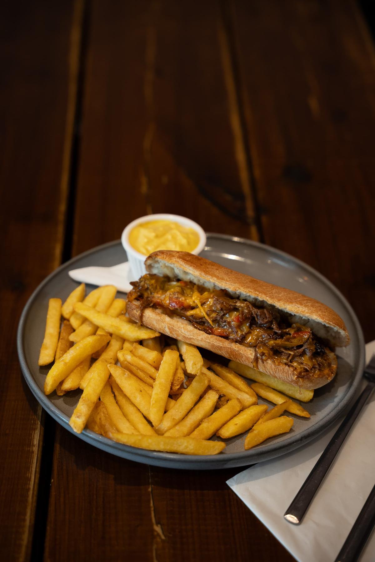 Steak sandwich and fries at Toast